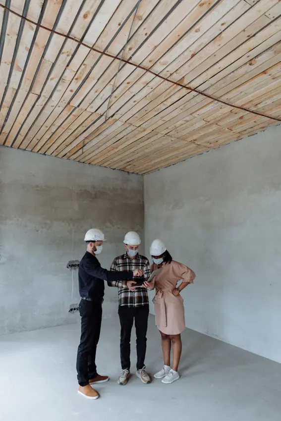 Professionals reviewing plans for a building project